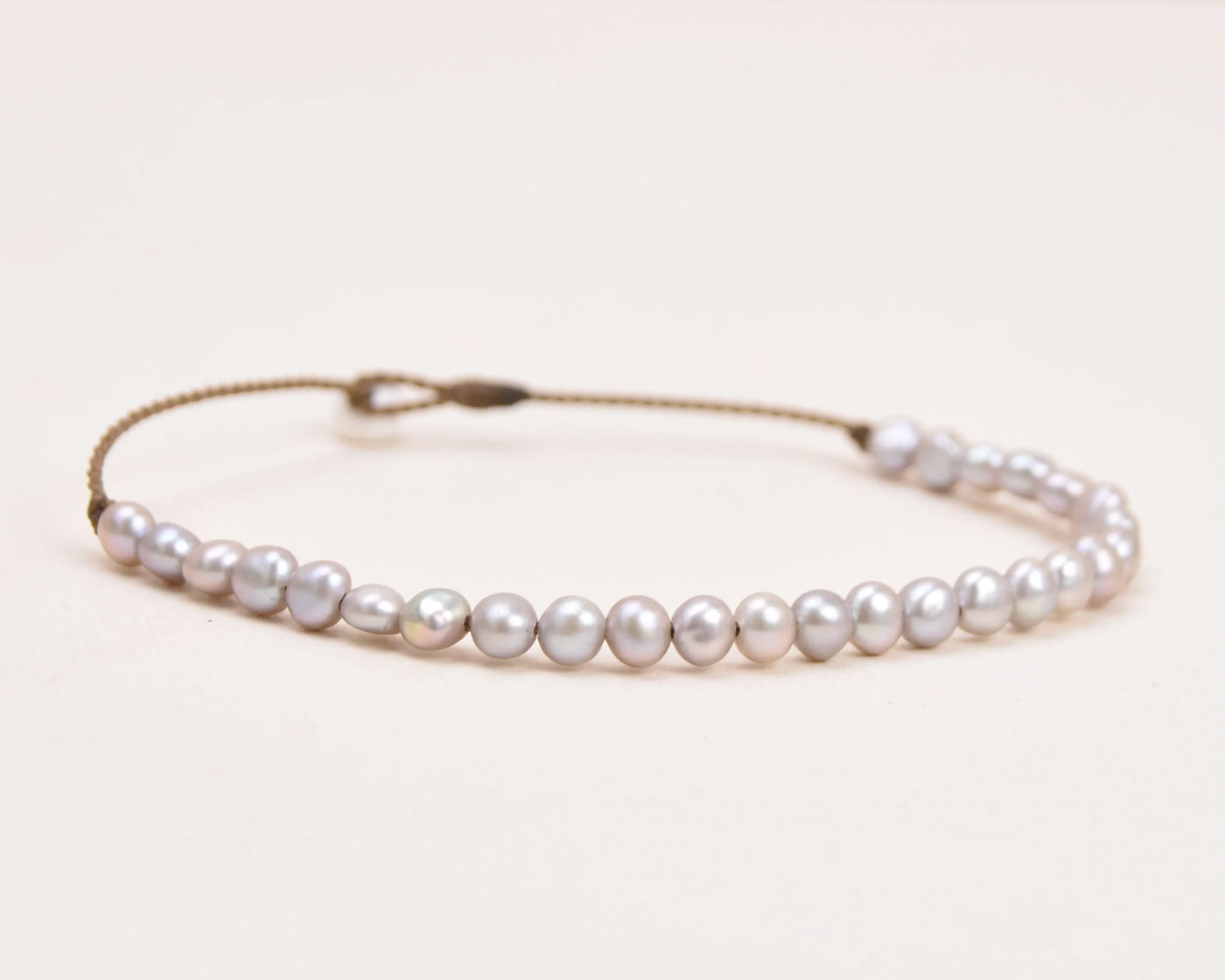 the crown anklet in silver pearls closeup with a white background