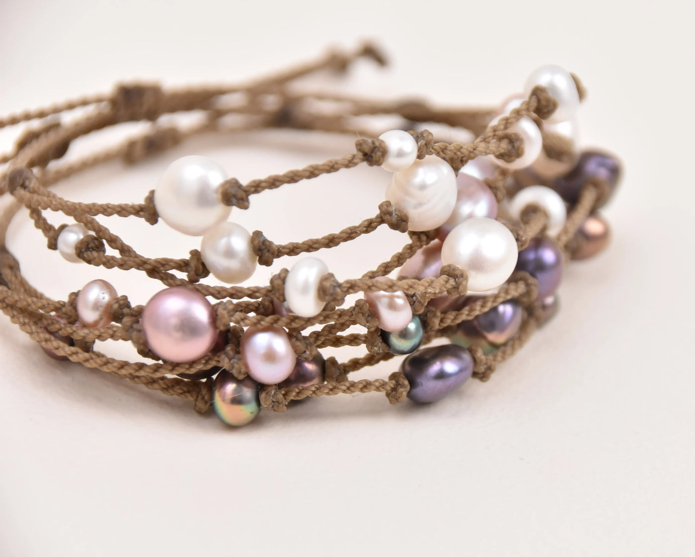 Tula Blue's Journey Bracelet in white blush and peacock stacked