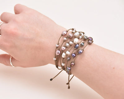 Tula Blue's Journey Bracelet in blush white and peacock on model wrist