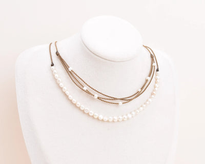 white pearl crown and white pearl riptide necklace on bust