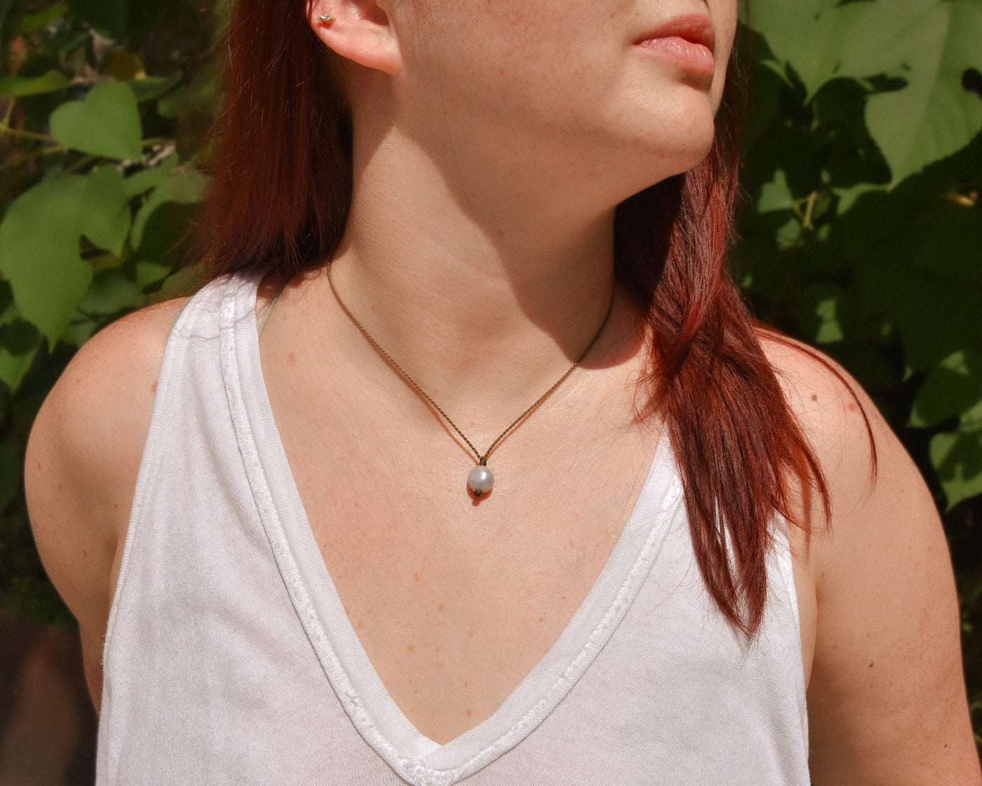 Pearl drop necklace in silver on model