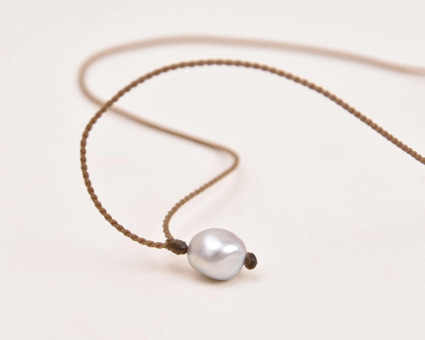 Pearl Drop Necklace in Silver on a white background