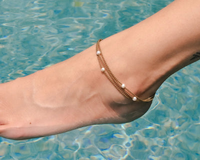 Tula Blue white pearl riptide anklet is waterproof and summer ready. All the drama of a stack in one perfect anklet. 
