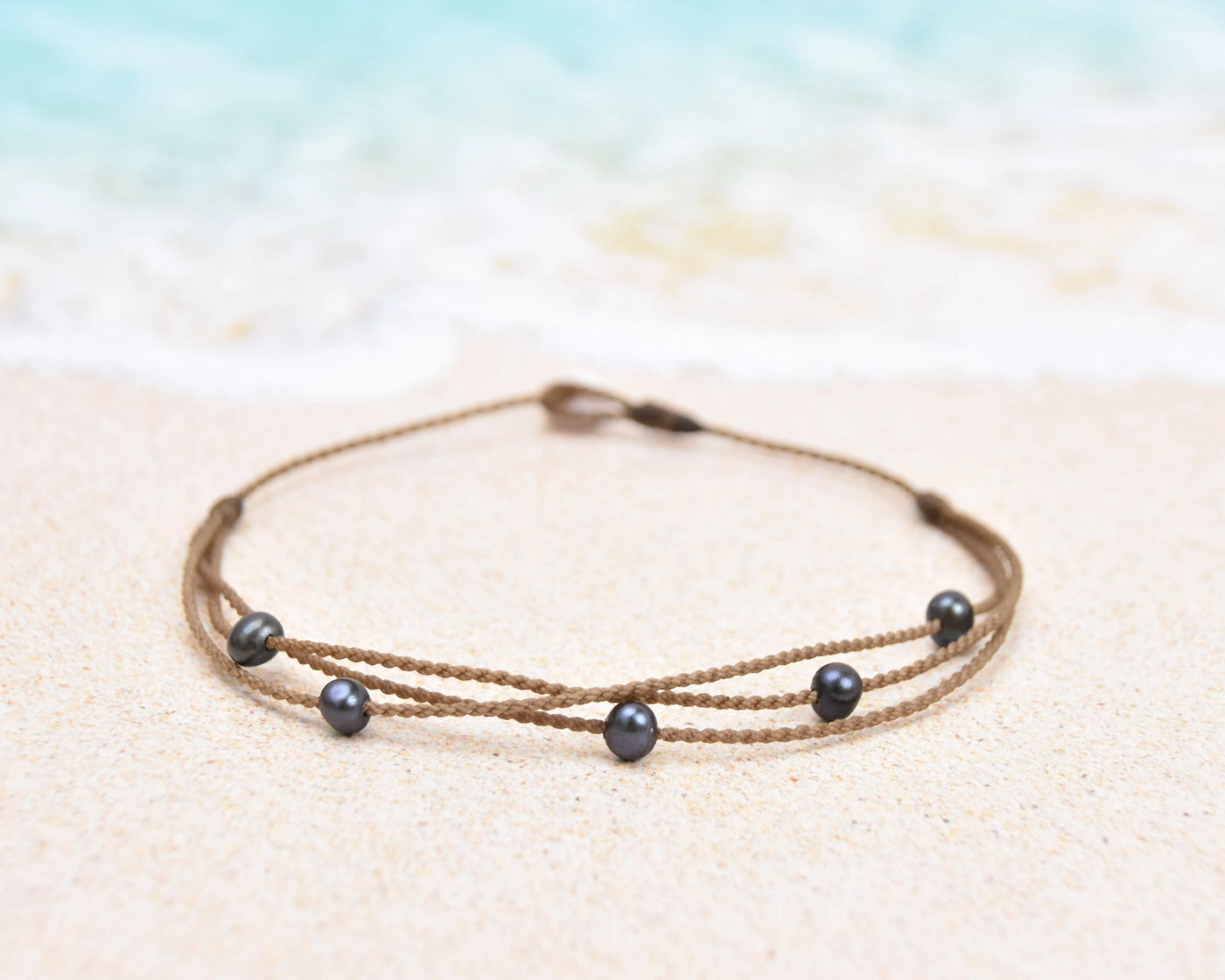 Tula Blue's waterproof Riptide anklet in peacock pearls. All the drama of a stack in one perfect anklet.