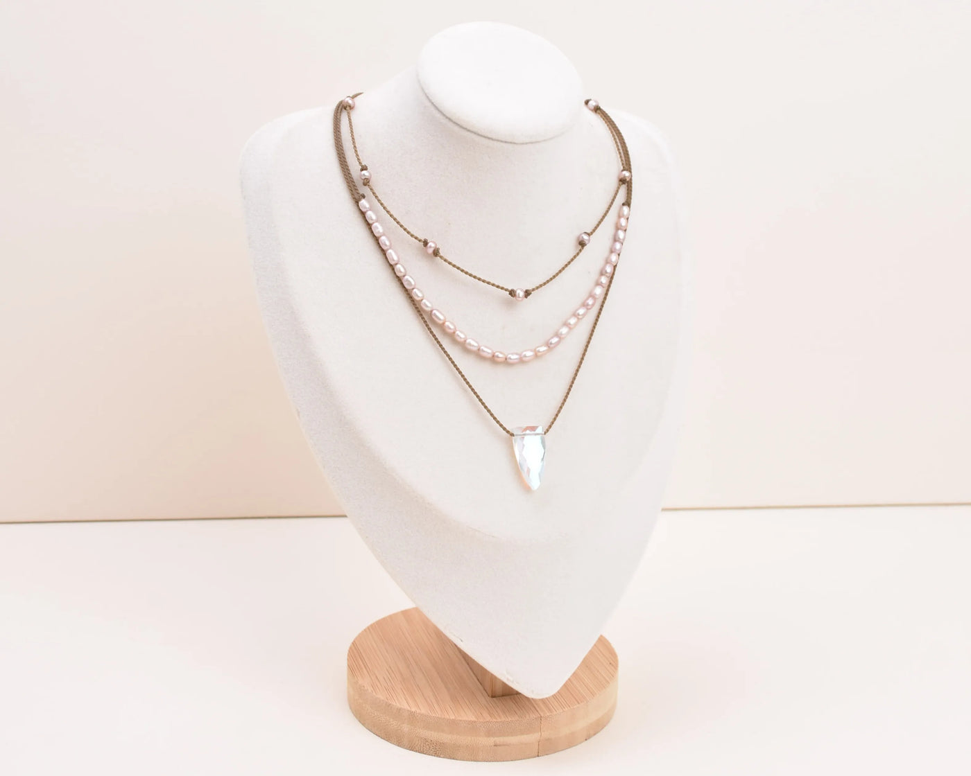 Rosy Aura Necklace Stack in blush on bust with white background