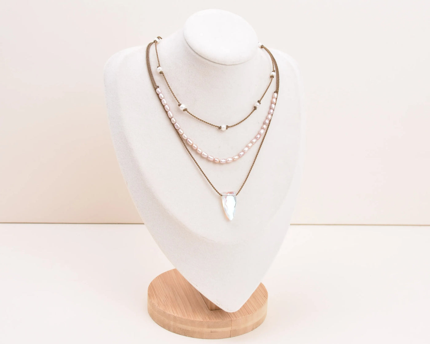 Rosy Aura Necklace Stack in white on bust with white background