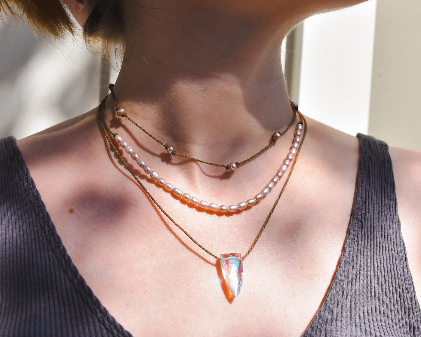 Rosy Aura Necklace Stack in blush on model with white background