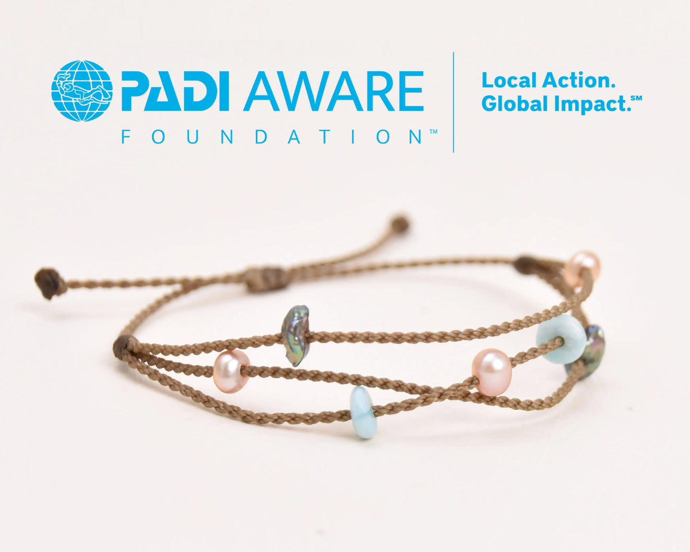 Seven Seas X PADI Riptide Bracelet with central blush pearl on white background
