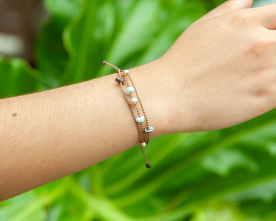 Seven Seas X PADI Riptide Bracelet with blush pearl on model wrist