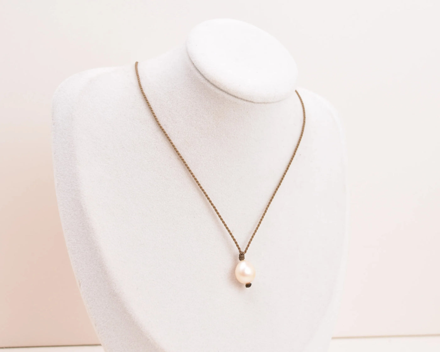 Pearl Drop Necklace in Peach on white bust