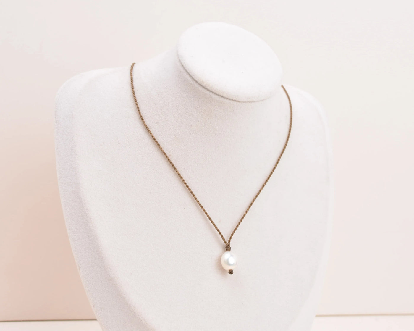 Pearl Drop Necklace in white on white bust