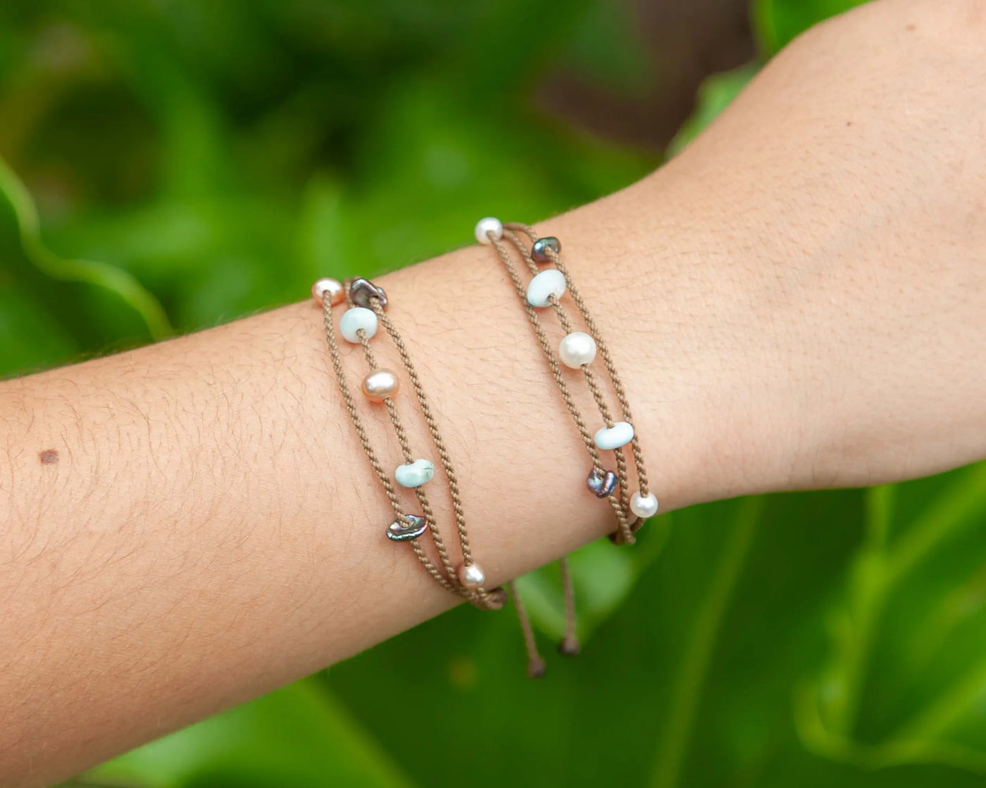 Seven Seas X PADI Riptide Bracelets with blush and white pearls on model wrist