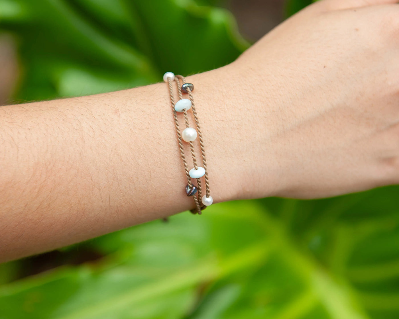 Seven Seas X PADI Riptide Bracelet with white pearl on wrist as a closeup